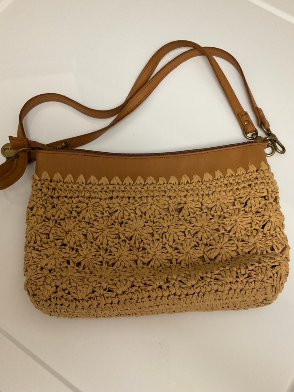 The sak small crochet bag and charm